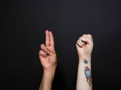 two-hands-sign-the-word-us two-hands-sign-the-word-us